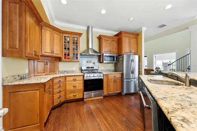 a living room with furniture and a dining table