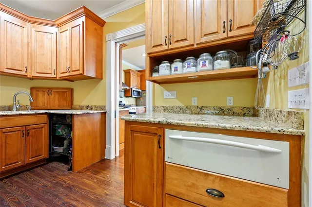 a spacious bathroom with a double vanity sink a mirror and a bathtub
