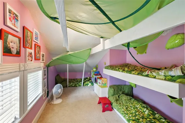 a view of swimming pool with a table and chairs