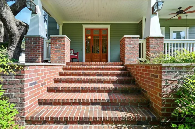 a living room with furniture a rug and a wooden floor