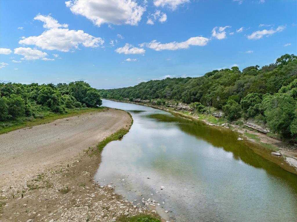 10106 Ravenswood Road Granbury, TX 76049 - Photo 35 of 39 a view of a lake with a yard