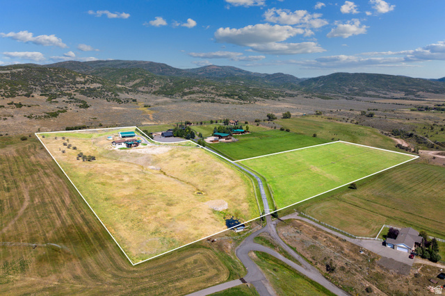 6117 North Rocky Ridge Road Peoa, UT 84061 - Photo 7 of 82 Expansive parcel featuring a main residence, multiple outbuildings, and a verdant field