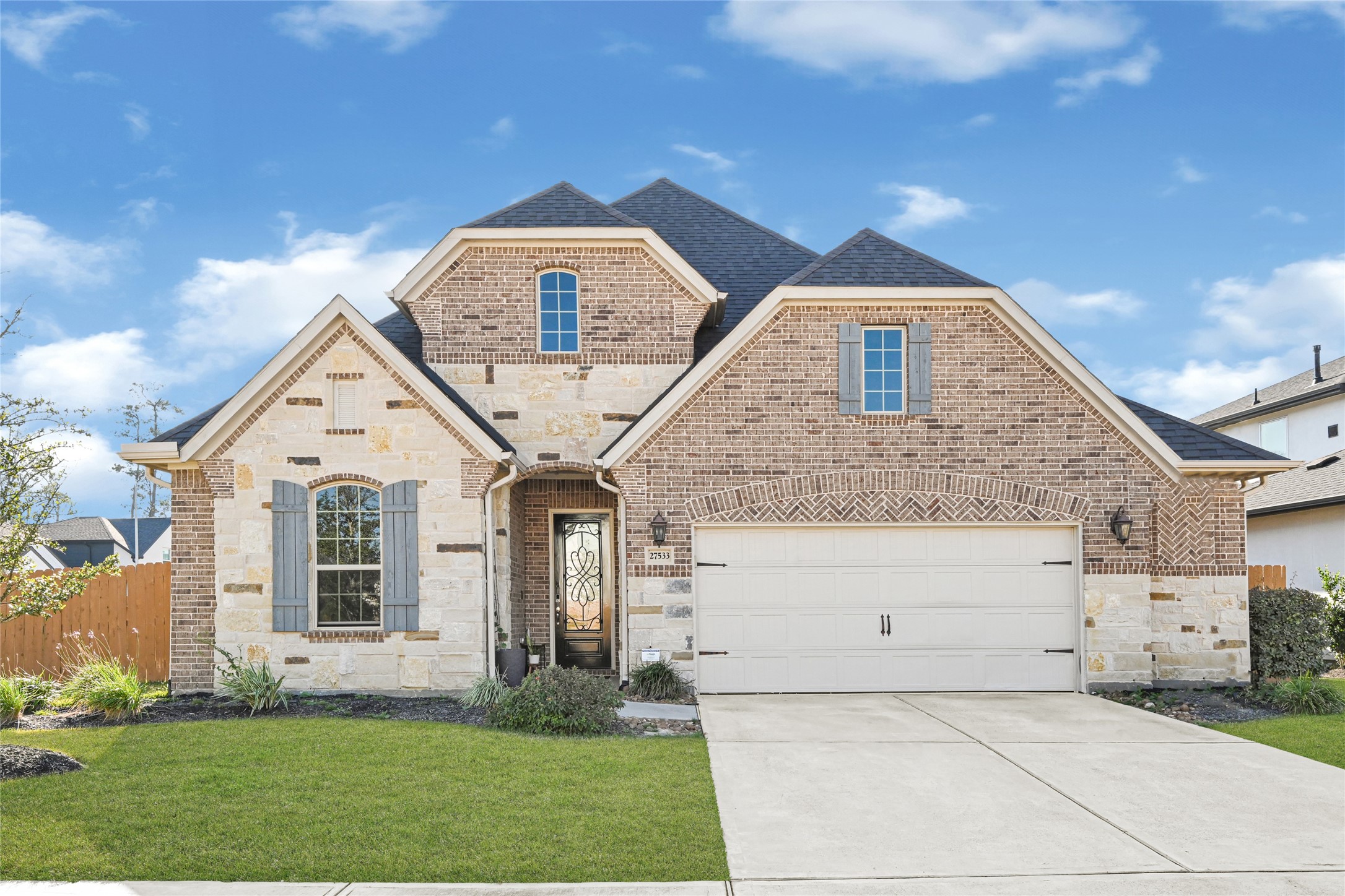 27533 Vivace Drive Spring, TX 77386 - Photo 1 of 26 a front view of a house with a yard
