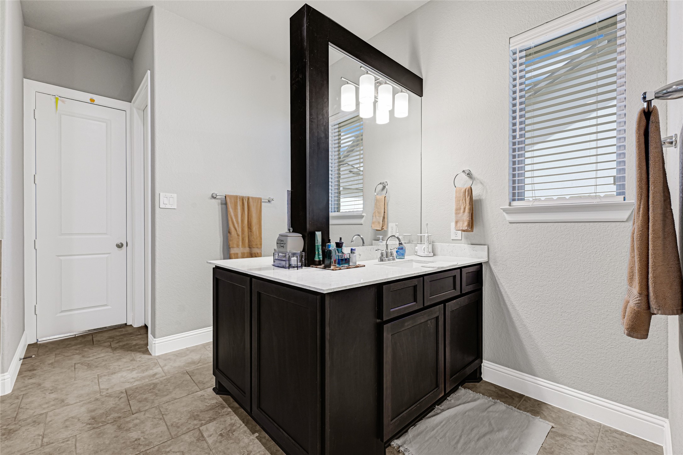 27533 Vivace Drive Spring, TX 77386 - Photo 12 of 26 a bathroom with a sink and a mirror