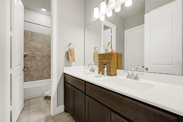 a bathroom with a sink double vanity and a mirror