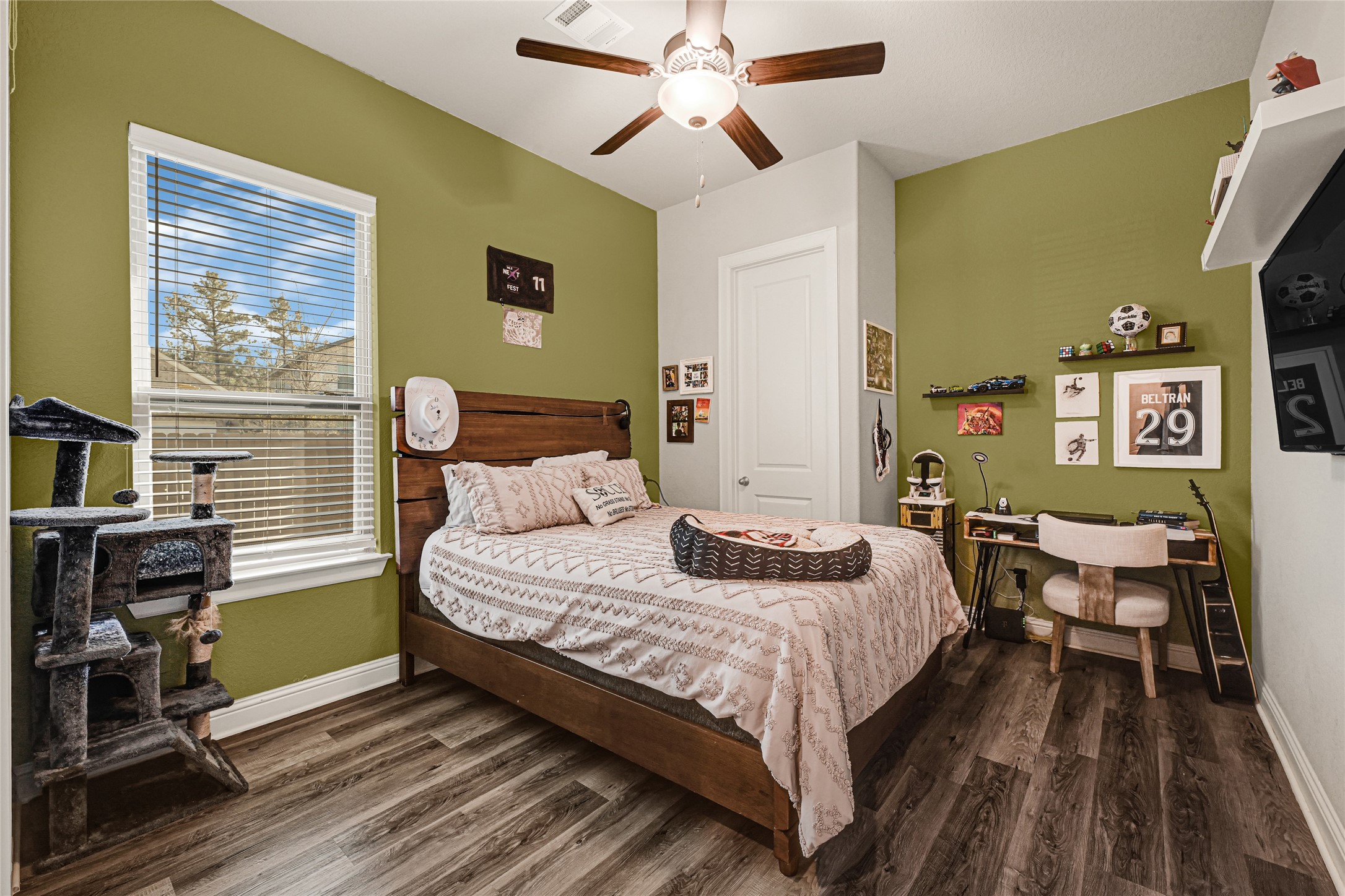 27533 Vivace Drive Spring, TX 77386 - Photo 17 of 26 a bedroom with a bed and wooden floor