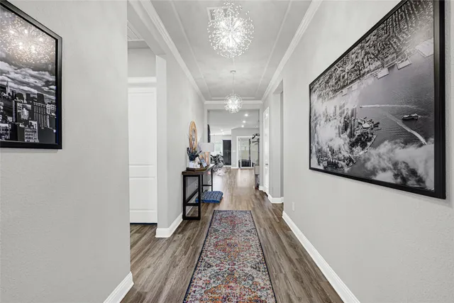 a view of a hallway with paintings on the wall