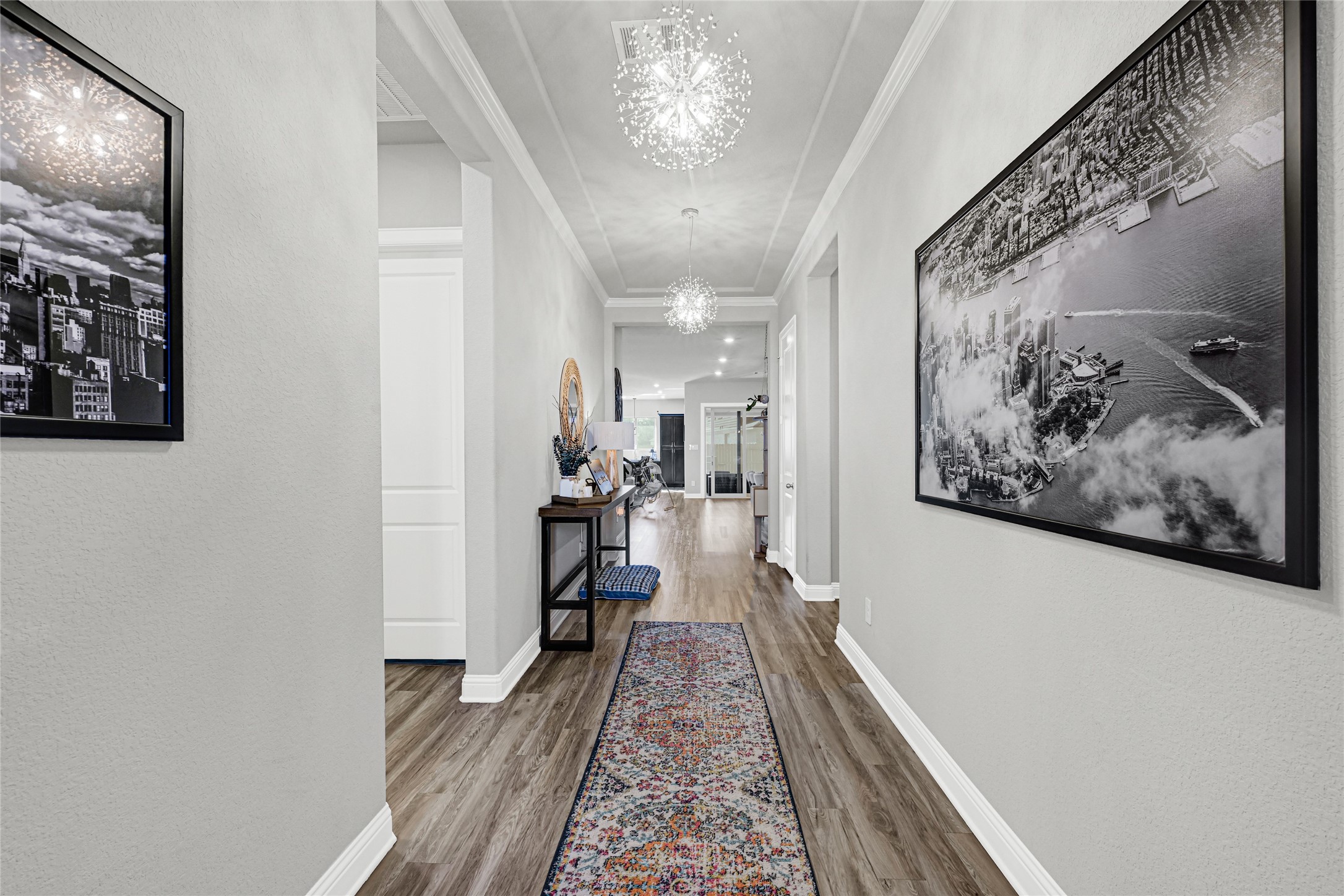 27533 Vivace Drive Spring, TX 77386 - Photo 2 of 26 a view of a hallway with paintings on the wall