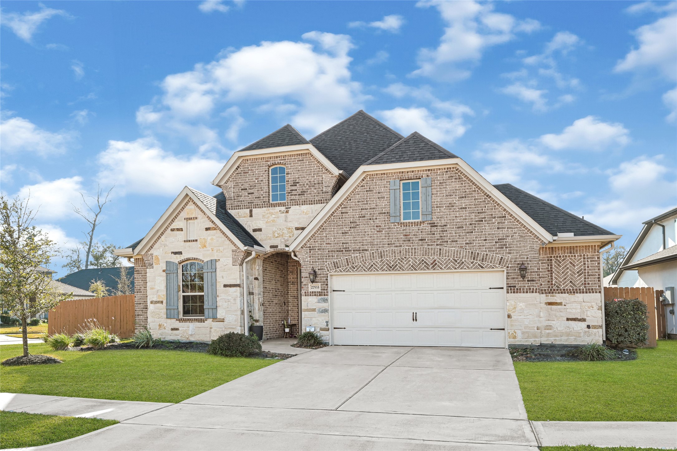 27533 Vivace Drive Spring, TX 77386 - Photo 25 of 26 a front view of a house with a yard