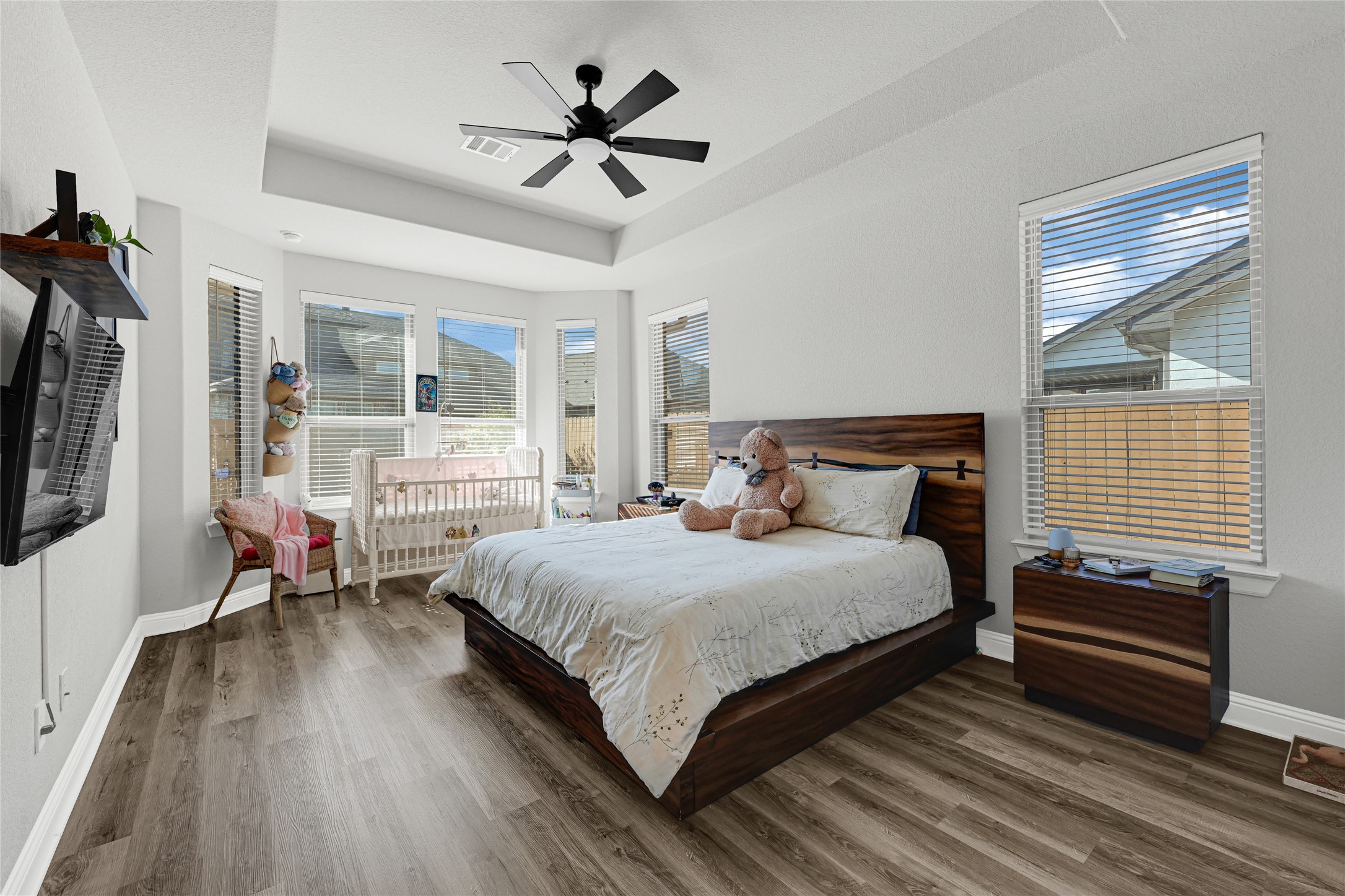 27533 Vivace Drive Spring, TX 77386 - Photo 10 of 26 a bedroom with a bed a chandelier and a window