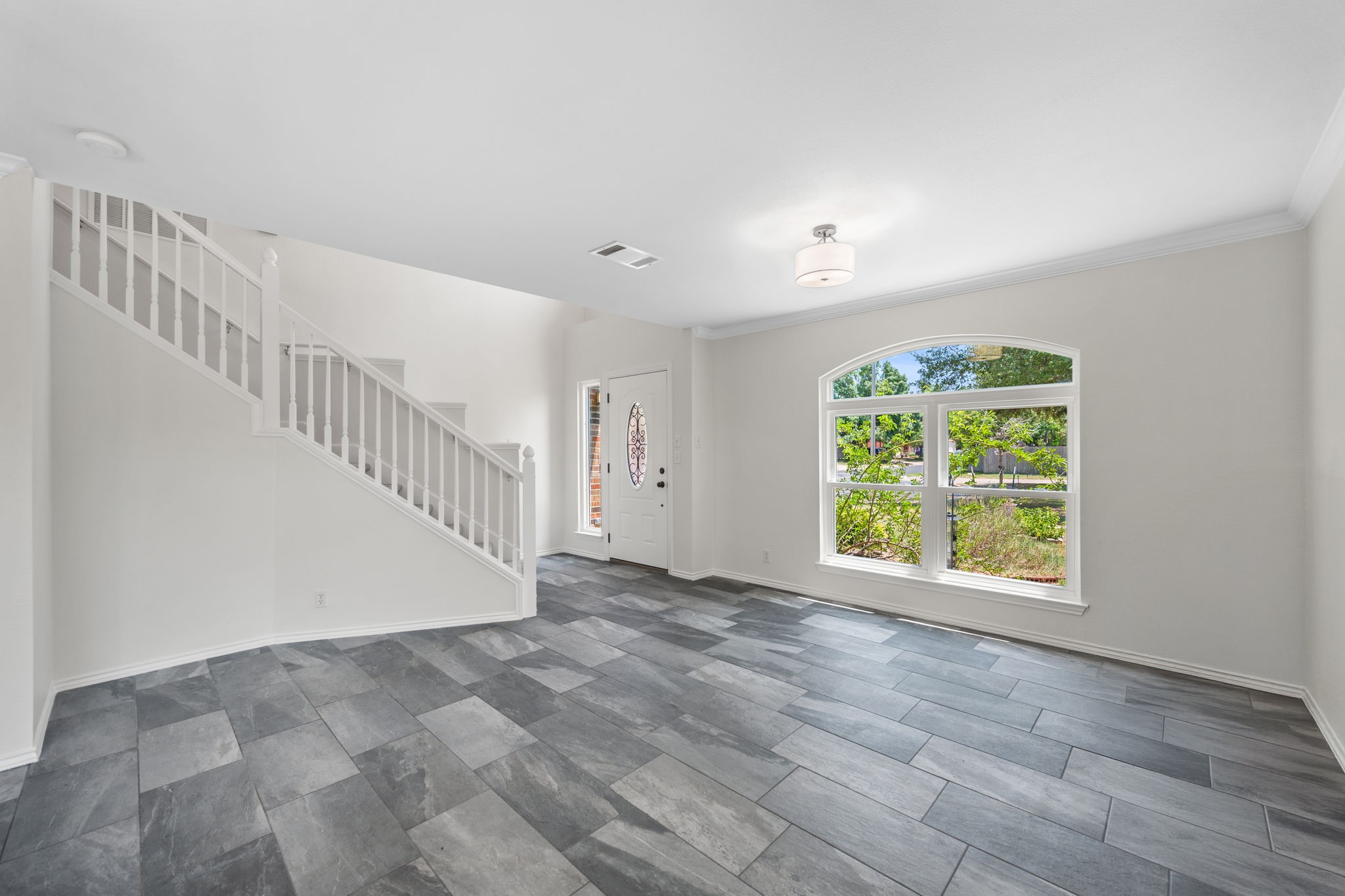 2440 Madeline Loop Cedar Park, TX 78613 - Photo 6 of 33 Unfurnished living room featuring stairs and baseboards
