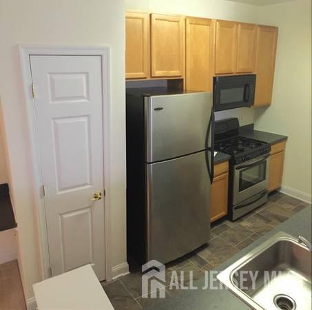 356 Samuel Circle Parlin, NJ 08859 - Photo 3 of 14 a kitchen with a refrigerator and a sink