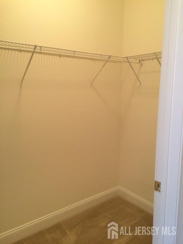 356 Samuel Circle Parlin, NJ 08859 - Photo 5 of 14 a view of small space with empty racks