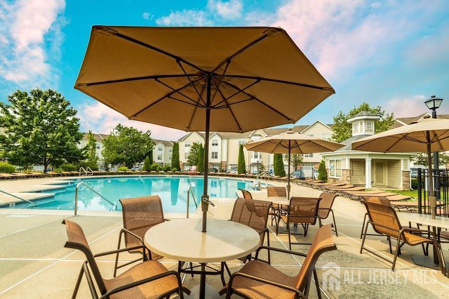 356 Samuel Circle Parlin, NJ 08859 - Photo 10 of 14 a patio with a patio table and chairs