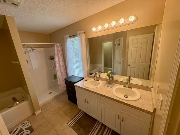 a bathroom with a sink a mirror and a toilet
