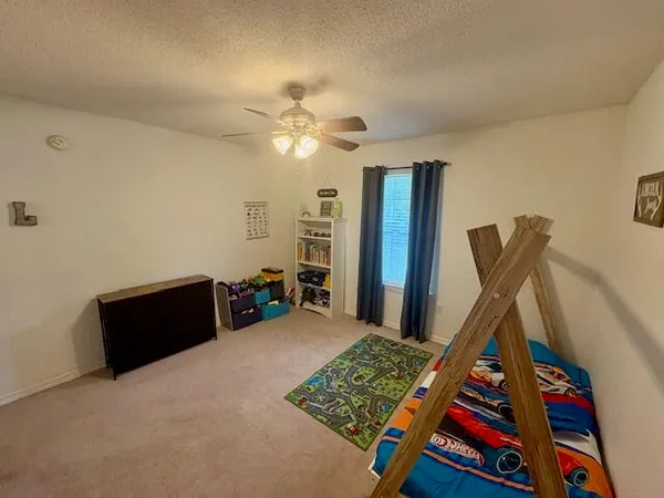 a very nice looking room with a large window and a rug