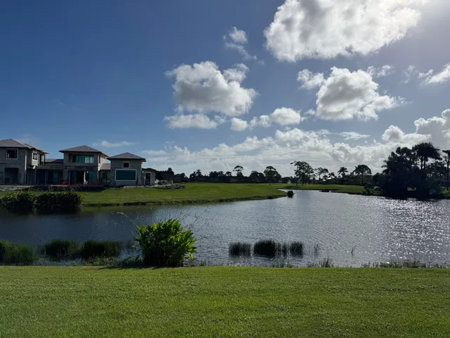 an aerial view of a house with a lake view