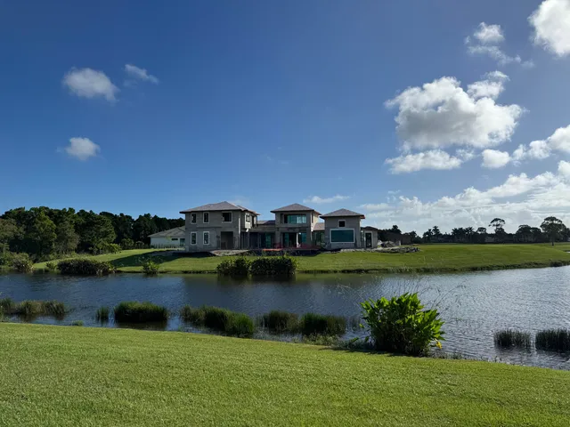 a view of a lake with houses in the back