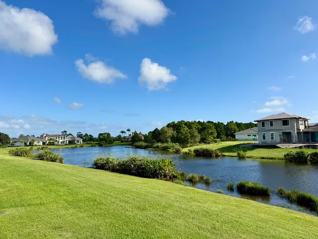 a view of a lake with houses in the background