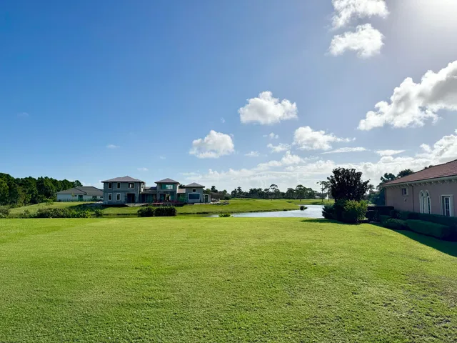 a view of a lake with a big yard