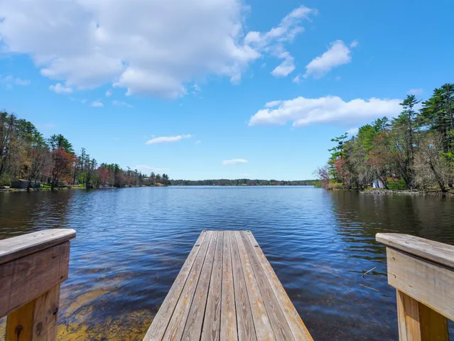 a wooden bridge near lake