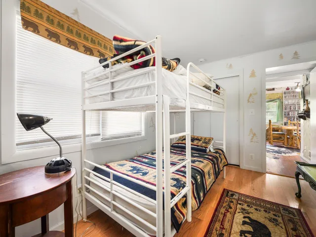 a bedroom with furniture and a window