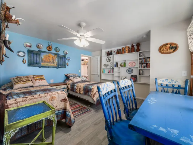 a bedroom with a bed and a table in it