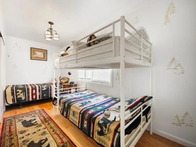 a bed room with bed and window