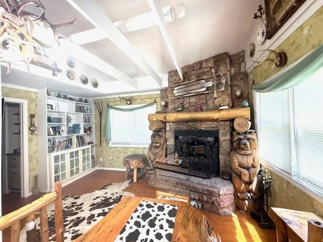 a living room with fireplace furniture and a fireplace