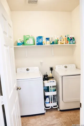 a utility room with dryer and washer