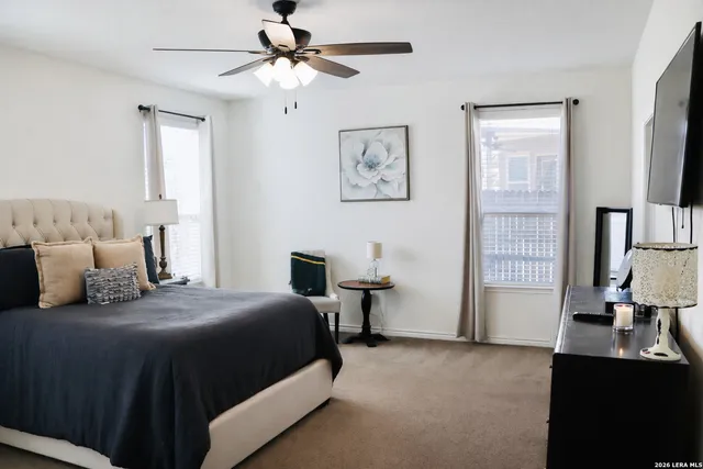 a bedroom with a bed and window