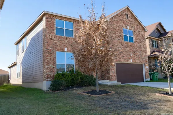 a front view of a house with a yard