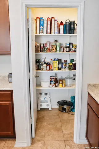 a room with a book shelf and a shelf