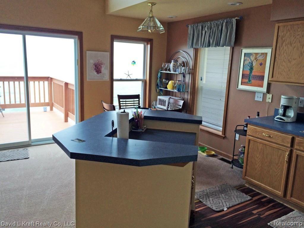 8564 Crescent Beach Road Pigeon, MI 48755 - Photo 4 of 28 8564CrescentBeachKitchenDining.jpg
