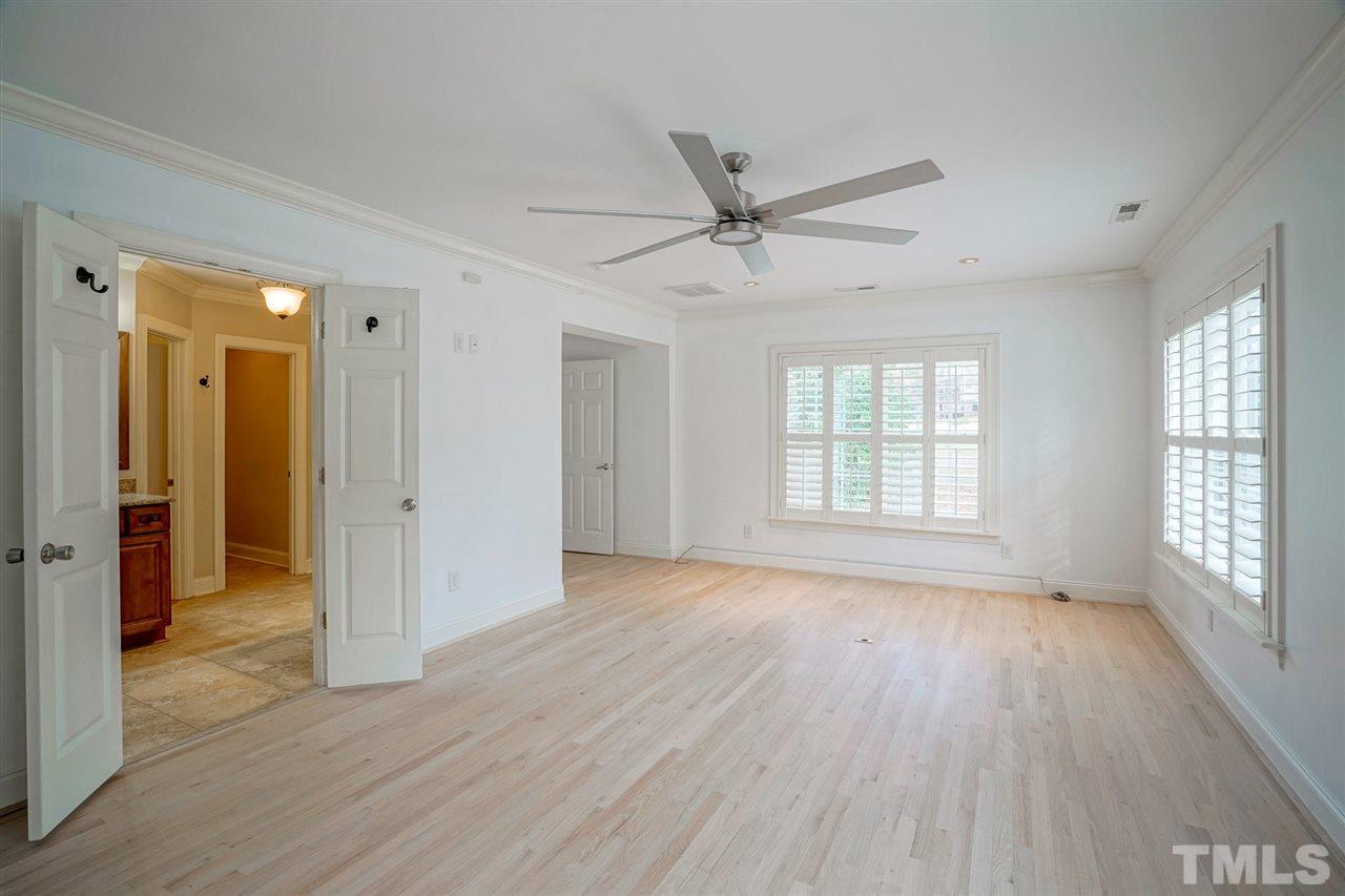 2606 Mayview Road Raleigh, NC 27607 - Photo 12 of 26 a view of empty room with wooden floor and fan