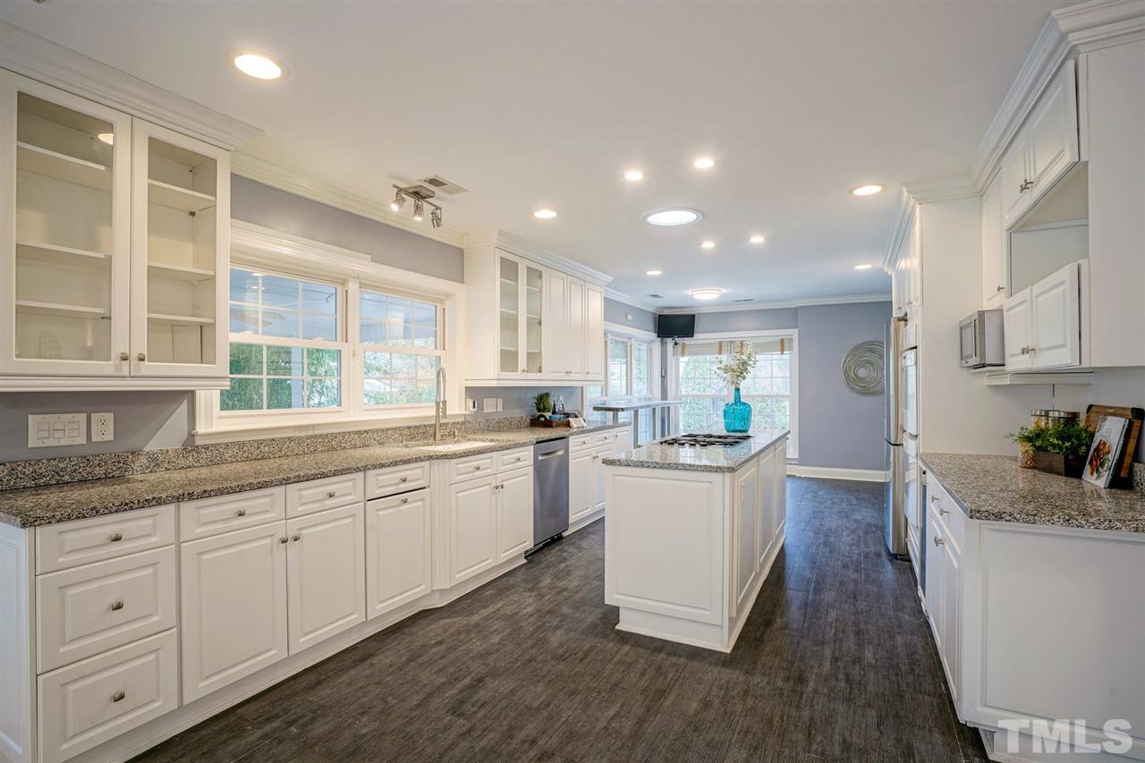 2606 Mayview Road Raleigh, NC 27607 - Photo 7 of 26 a kitchen with sink and wooden floor