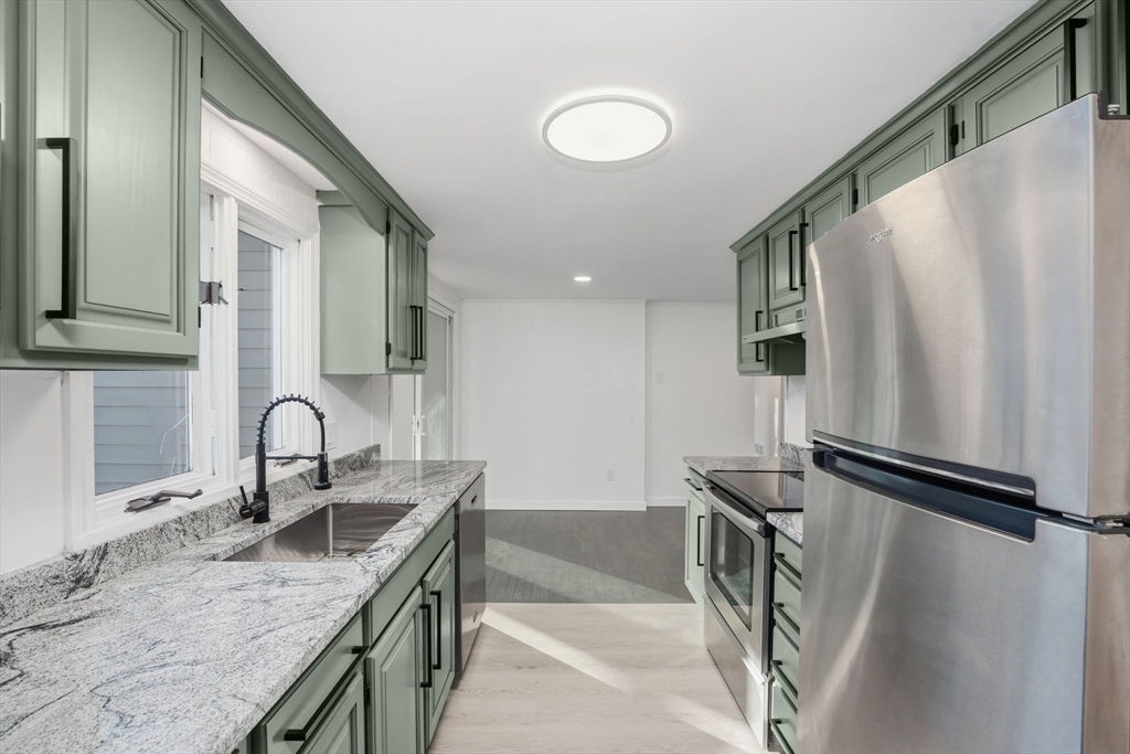 95 Samson Avenue Somerset, MA 02726 - Photo 12 of 36 a kitchen with stainless steel appliances granite countertop a sink and a refrigerator