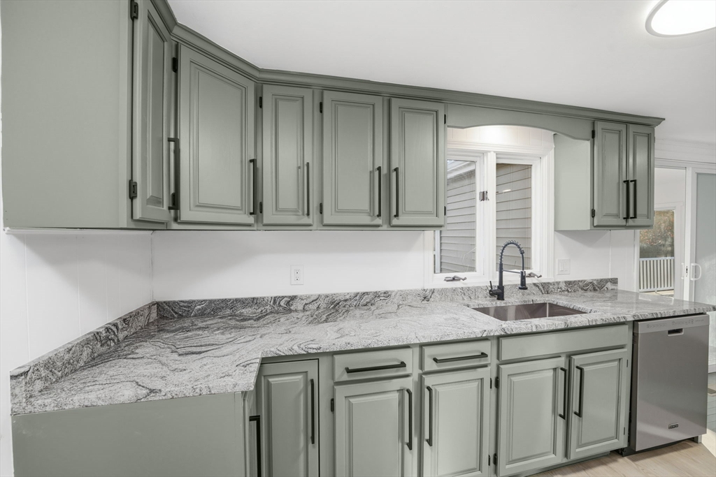 95 Samson Avenue Somerset, MA 02726 - Photo 13 of 36 a sink with granite countertop cabinets and a sink