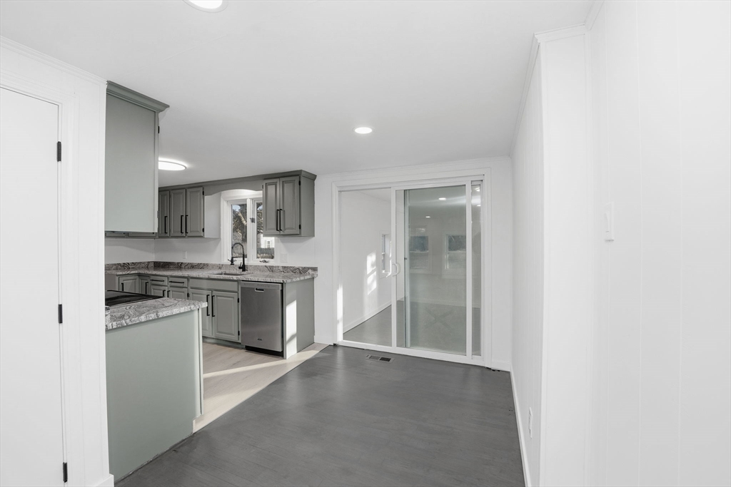 95 Samson Avenue Somerset, MA 02726 - Photo 14 of 36 a open kitchen with a sink and white cabinets