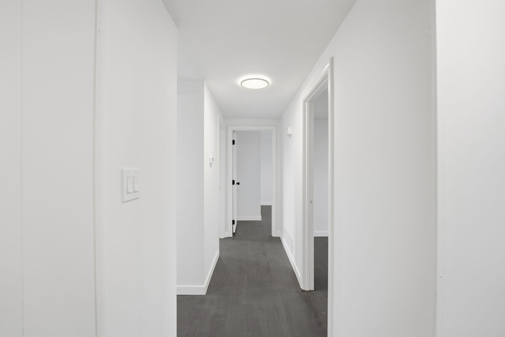 95 Samson Avenue Somerset, MA 02726 - Photo 15 of 36 a view of a hallway with wooden floor
