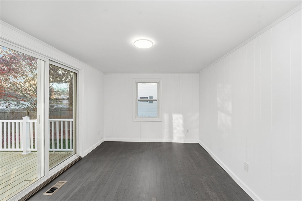 95 Samson Avenue Somerset, MA 02726 - Photo 23 of 36 an empty room with wooden floor and windows