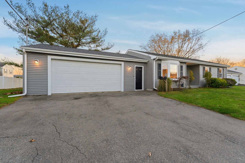 95 Samson Avenue Somerset, MA 02726 - Photo 6 of 36 front view of house with a yard and potted plants