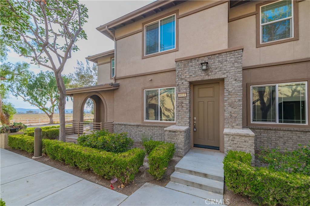 a front view of a house with garden