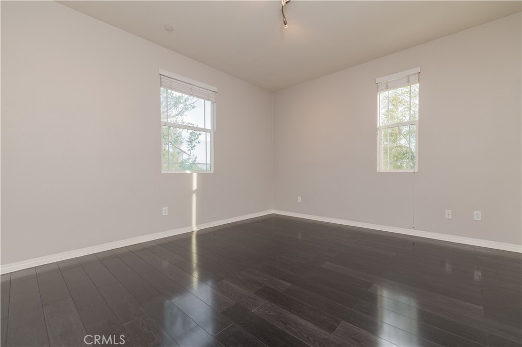 6014 Eucalyptus Avenue Chino, CA 91710 - Photo 11 of 16 an empty room with wooden floor and window