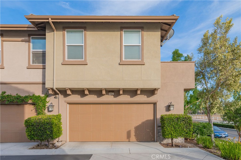 6014 Eucalyptus Avenue Chino, CA 91710 - Photo 16 of 16 a front view of a house with yard