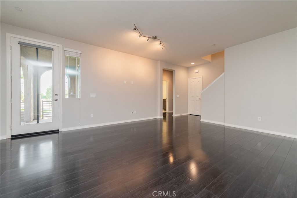 6014 Eucalyptus Avenue Chino, CA 91710 - Photo 2 of 16 a view of a livingroom with wooden floor