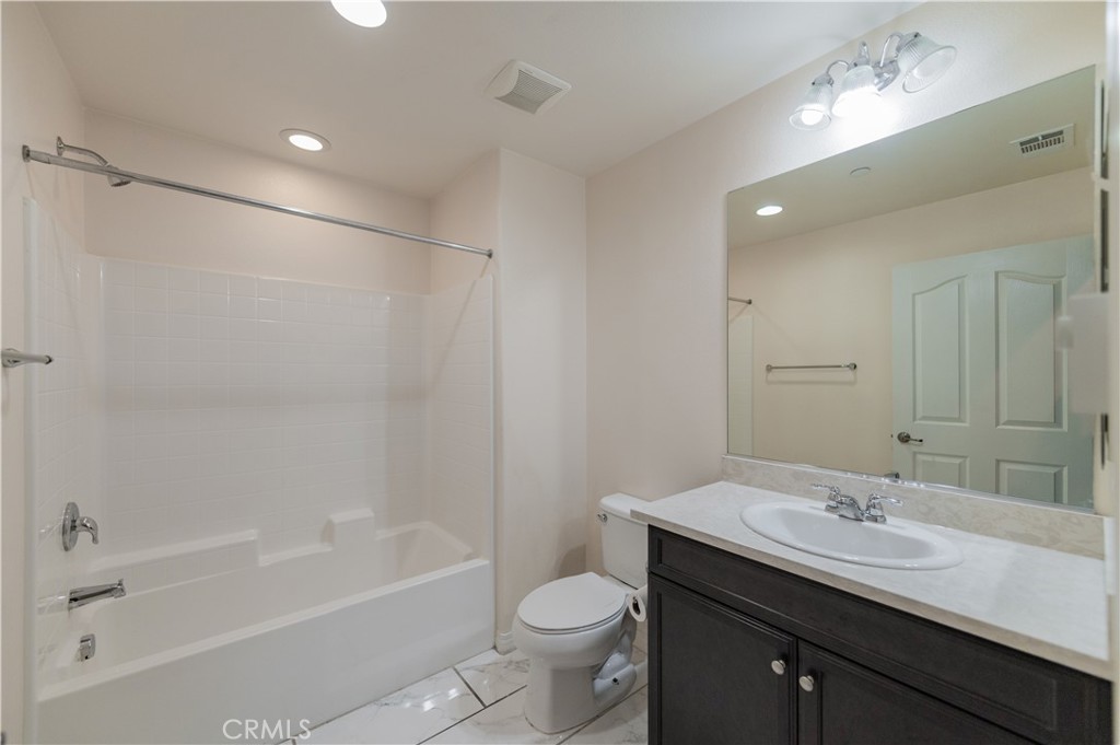 6014 Eucalyptus Avenue Chino, CA 91710 - Photo 7 of 16 a bathroom with a sink a toilet and shower