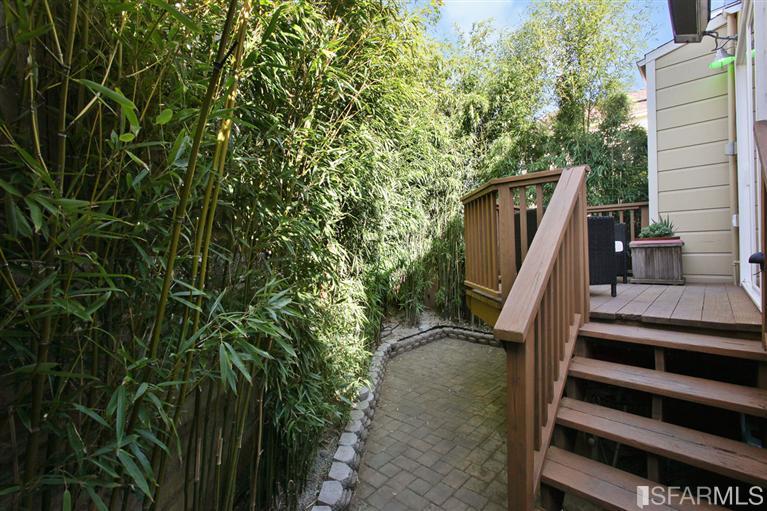 3754 Cesar Chavez San Francisco, CA 94110 - Photo 15 of 22 Deck with stairs leading to small garden. Utility room and garage to the right of stairs.
