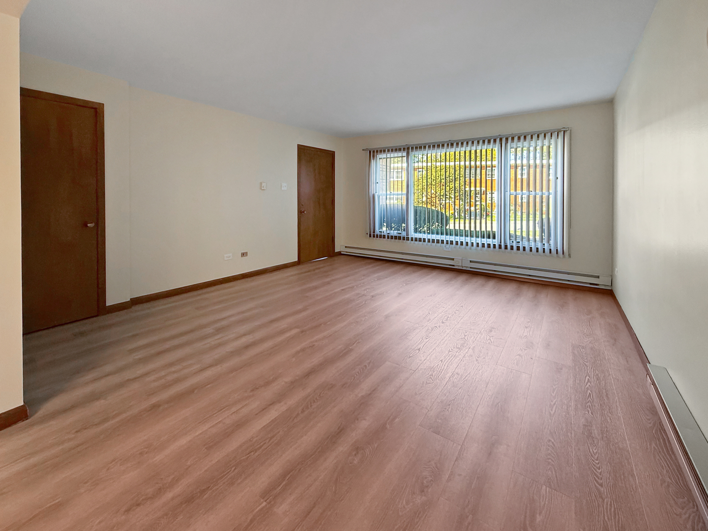 2025 Maple Road, Unit 1E Homewood, IL 60430 - Photo 3 of 12 a view of a room with wooden floor and windows
