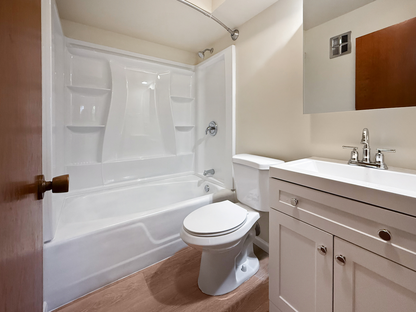 2025 Maple Road, Unit 1E Homewood, IL 60430 - Photo 7 of 12 a bathroom with a sink a toilet and a bathtub